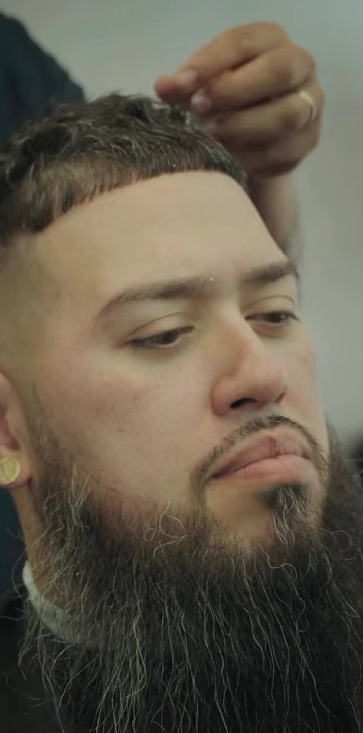 Close-up of client with full beard and styled hair at Studio Blends